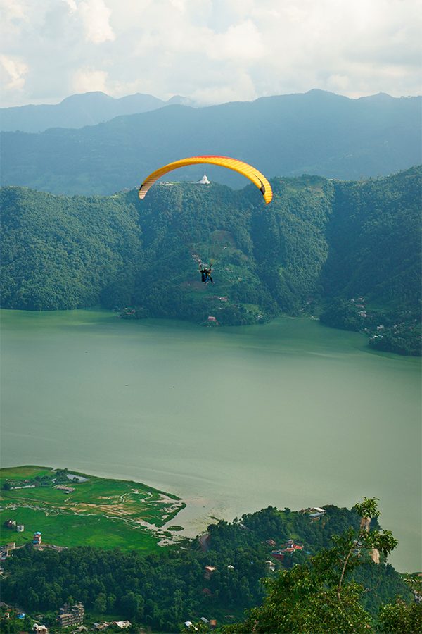 Paragliding above a lake
